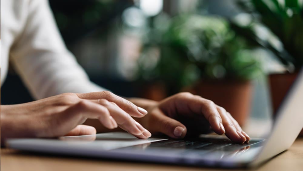 People writing on laptops, Co2 bonus, GHG quota